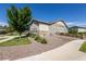 Exterior shot of the side of the house, showcasing the gravel landscaping and fenced yard at 26722 E Peakview Pl, Aurora, CO 80016