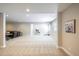 Spacious finished basement featuring plush carpet and large openings to maximize space at 26722 E Peakview Pl, Aurora, CO 80016