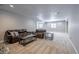 Finished basement with plush carpet offers an inviting area to gather and relax with comfortable furniture at 26722 E Peakview Pl, Aurora, CO 80016