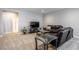 Finished basement offers space for relaxation with a plush couch and media entertainment at 26722 E Peakview Pl, Aurora, CO 80016