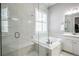 Bright bathroom with a soaking tub, glass enclosed shower, and marble tile accents at 26722 E Peakview Pl, Aurora, CO 80016