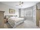 Comfortable bedroom featuring a ceiling fan, plush carpeting, shuttered windows, and neutral decor at 26722 E Peakview Pl, Aurora, CO 80016