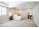 Bedroom features a plush carpet, a ceiling with inset lights, and a large window with white trim at 26722 E Peakview Pl, Aurora, CO 80016
