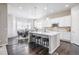 Modern kitchen with a large island, stainless steel appliances, and white cabinetry, ideal for cooking at 26722 E Peakview Pl, Aurora, CO 80016