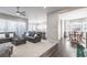 Spacious living room seamlessly connects to the kitchen and dining area, perfect for entertaining at 26722 E Peakview Pl, Aurora, CO 80016