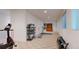 Finished basement includes treadmill, free weights, and cabinet to create your private gym at 6187 Reed Way, Arvada, CO 80003