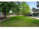 Well maintained yard with large trees, healthy green grass and garden beds at 9315 Field Ln, Westminster, CO 80021