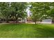Image of backyard featuring sheds, trees, and plenty of green space at 9315 Field Ln, Westminster, CO 80021