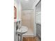 Bathroom featuring a pedestal sink and walk-in shower at 9315 Field Ln, Westminster, CO 80021