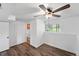 Bright bedroom featuring a ceiling fan, window, closet and views of the yard at 9315 Field Ln, Westminster, CO 80021