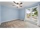 Inviting bedroom with a large window, light blue walls, and soft natural light at 9315 Field Ln, Westminster, CO 80021