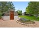 Image of a backyard greenhouse and garden, and the main home with upper deck at 9315 Field Ln, Westminster, CO 80021