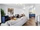 Bright living room with modern decor, hardwood floors, stylish furniture, and an open concept layout at 9315 Field Ln, Westminster, CO 80021