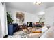 Bright living room with modern decor, hardwood floors, stylish furniture, and an open concept layout at 9315 Field Ln, Westminster, CO 80021
