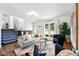 Bright living room with modern decor, hardwood floors, stylish furniture, and an open concept layout at 9315 Field Ln, Westminster, CO 80021