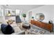 Bright and open living area with stairs, stylish decor, and a comfortable sofa at 9315 Field Ln, Westminster, CO 80021