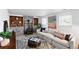 Cozy living room with a decorative fireplace, a comfortable sofa, and stylish decor at 9315 Field Ln, Westminster, CO 80021