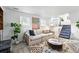 Comfortable living room with a modern rug, large sofa, and bright windows for natural light at 9315 Field Ln, Westminster, CO 80021