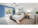 Spacious main bedroom featuring a private balcony, stylish decor, and ample natural light at 9315 Field Ln, Westminster, CO 80021