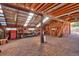 Spacious barn interior featuring a wooden structure, ample storage space, and natural light at 60 N County Highway 67, Sedalia, CO 80135