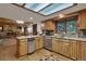 Well-appointed kitchen featuring stainless steel appliances, granite countertops, and wood cabinets at 60 N County Highway 67, Sedalia, CO 80135
