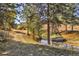 Scenic view with a path, stream, and a glimpse of a rustic barn in the background at 60 N County Highway 67, Sedalia, CO 80135