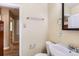 Bathroom with a vanity sink with the tiled shower partially visible at 1325 Geneva St, Aurora, CO 80010