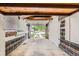 Spacious garage featuring block walls and concrete floors, offering ample storage and parking space at 1325 Geneva St, Aurora, CO 80010