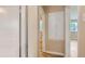 Hallway with hardwood floors and access to multiple rooms at 1325 Geneva St, Aurora, CO 80010