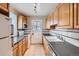 Efficient kitchen with ample cabinet space, tile backsplash, and modern appliances at 1325 Geneva St, Aurora, CO 80010