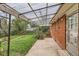 Covered patio adjacent to brick home, perfect for outdoor dining with landscaped backyard at 1325 Geneva St, Aurora, CO 80010