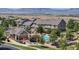 Community pool surrounded by townhomes and beautiful mountain views on the horizon at 4718 Raven Run, Broomfield, CO 80023