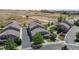 Aerial shot featuring townhomes and their proximity to walking paths and green spaces at 4718 Raven Run, Broomfield, CO 80023