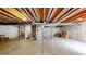 Unfinished basement with exposed ceiling, concrete floors and ready for personalization at 4718 Raven Run, Broomfield, CO 80023