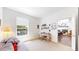 Bright bedroom with hardwood floors that opens up into a living room at 4718 Raven Run, Broomfield, CO 80023