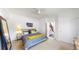 Bedroom featuring a ceiling fan, neutral decor, carpeted floors, and natural light at 4718 Raven Run, Broomfield, CO 80023