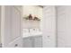 Laundry room featuring a washer, dryer, and shelving for storage at 4718 Raven Run, Broomfield, CO 80023