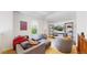 Cozy living room with modern furniture and a large window at 4718 Raven Run, Broomfield, CO 80023