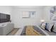 This bedroom features a picture window, stylish bed and accents at 7185 S Gaylord St # G13, Littleton, CO 80122