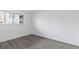 Bedroom with a bright window, and wood-look vinyl flooring at 7185 S Gaylord St # G13, Littleton, CO 80122