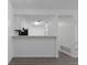 Bright kitchen pass-through with sleek countertops, perfect for entertaining and easy serving at 7185 S Gaylord St # G13, Littleton, CO 80122