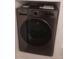 Modern LG washer and dryer combo set in laundry room, ready for convenient in-home cleaning at 7185 S Gaylord St # G13, Littleton, CO 80122