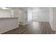 Bright and airy living room space with updated flooring and neutral tones, offering a blank canvas at 7185 S Gaylord St # G13, Littleton, CO 80122