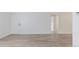 Bright, freshly painted living room featuring modern flooring, ready for your personal touch at 7185 S Gaylord St # G13, Littleton, CO 80122