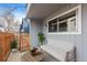 Private patio with comfortable seating and privacy fence at 7185 S Gaylord St # G13, Littleton, CO 80122