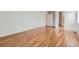 Bright bedroom featuring gleaming hardwood floors and neutral wall color at 5120 Perth St, Denver, CO 80249