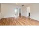 Spacious bedroom featuring hardwood floors and neutral paint, offering a versatile living space at 5120 Perth St, Denver, CO 80249