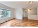Bright bedroom with large window and gleaming hardwood floors at 5120 Perth St, Denver, CO 80249