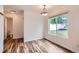 Dining room featuring modern flooring, and a large window providing plenty of natural light at 5120 Perth St, Denver, CO 80249