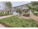 Two-story home with a two-car garage, a manicured lawn, and mature landscaping at 5120 Perth St, Denver, CO 80249